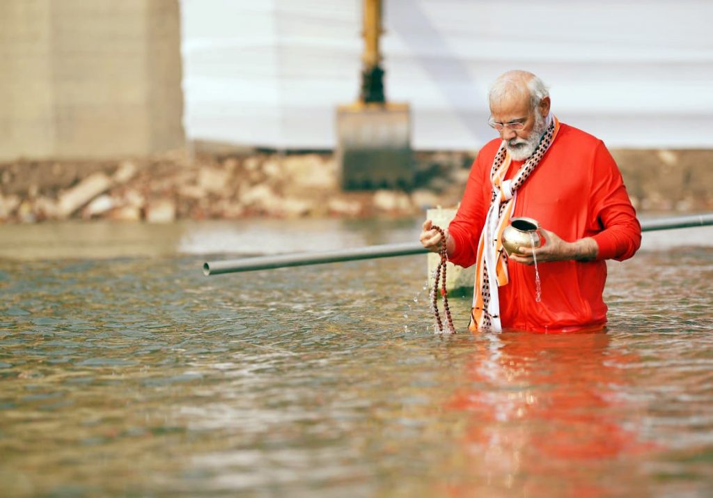 Varanasi, Dec 13 (ANI): Prime Minister Narendra Modi offering prayer to river Ganga, in Varanasi on Monday. (ANI Photo)