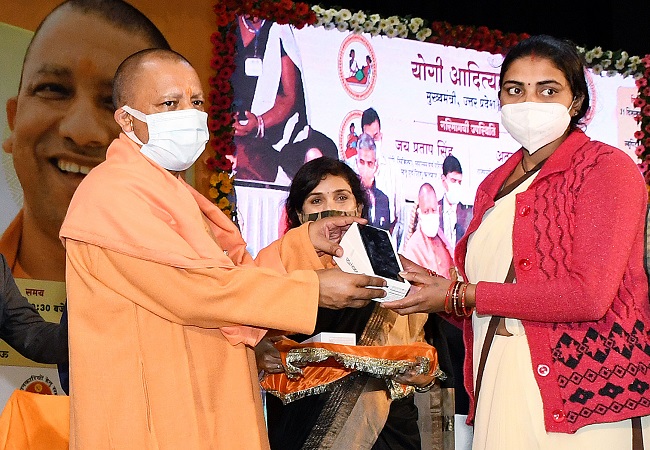Yogi Adityanath distributes mobile phones to Asha workers