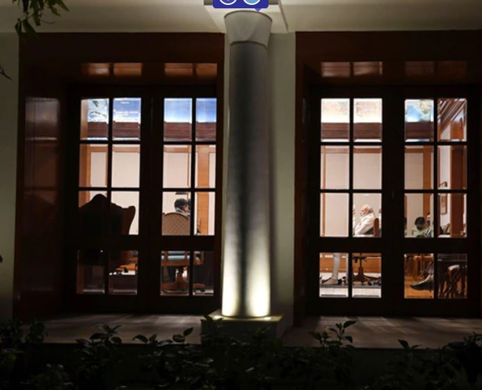 PM Modi presiding over a late night meeting at his residence
