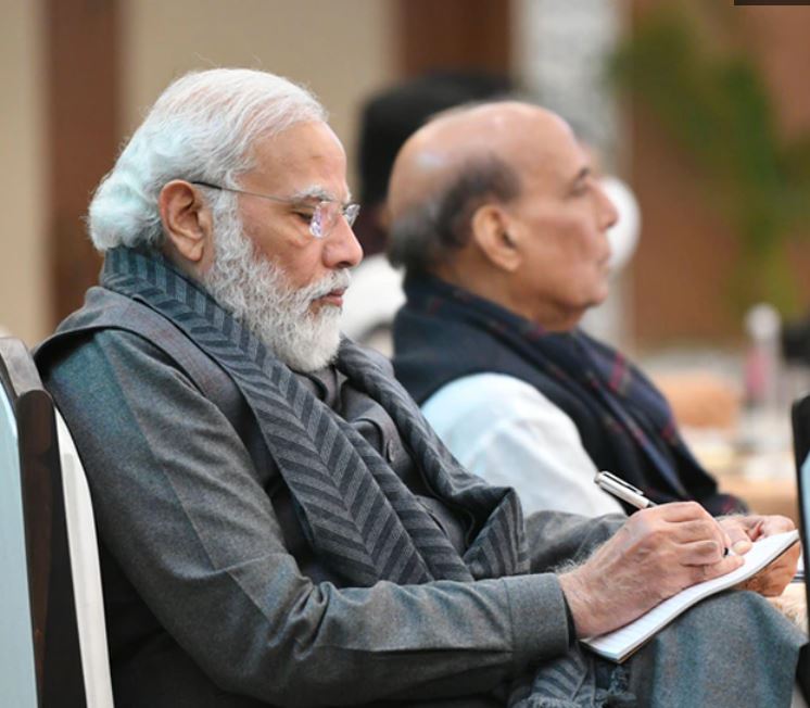 PM Modi taking notes during a Council of Ministers meeting