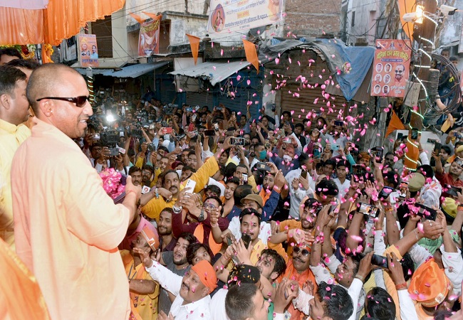 Yogi Adityanath celebrates Holi in Gorakhpur with sunglasses, toy bulldozer [SEE PICS]
