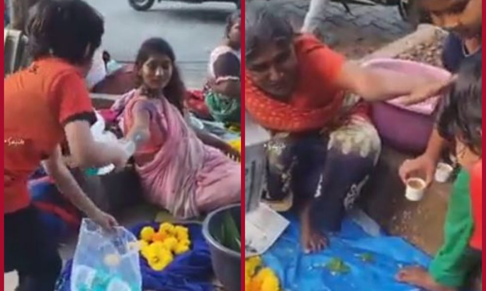 Netizens hail little boy for offering water bottles to street vendors