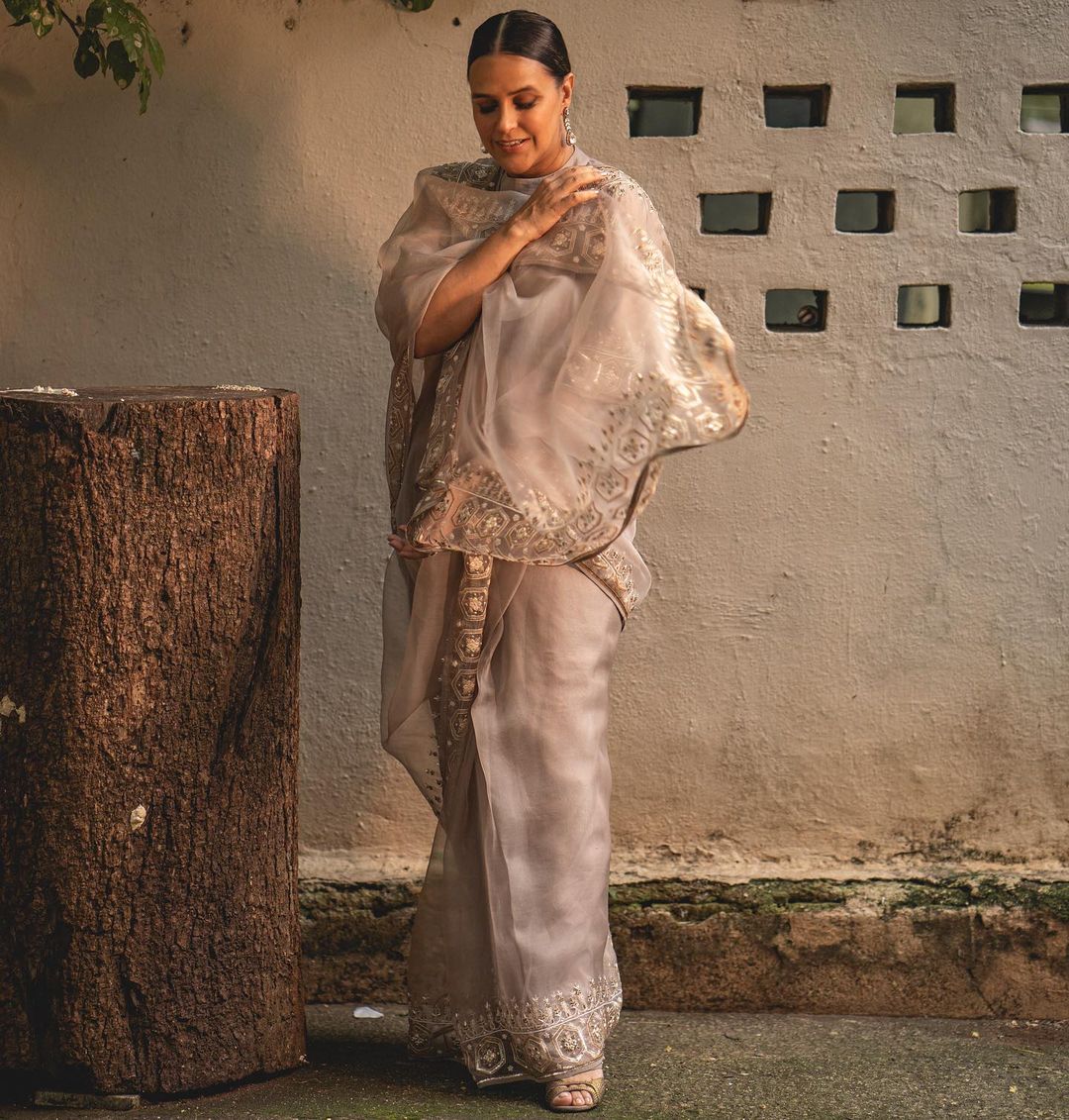 Neha Dhupia exudes royalty in ivory white saree