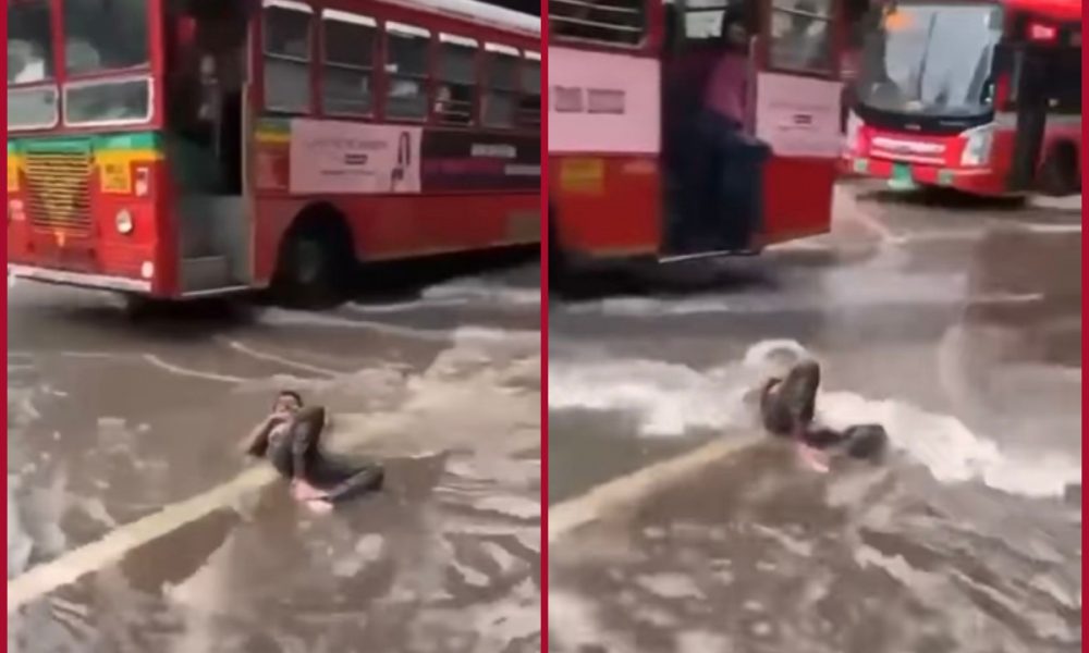 Man lies on waterlogged Mumbai road sending out Maldives vibes; Netizens feel amused