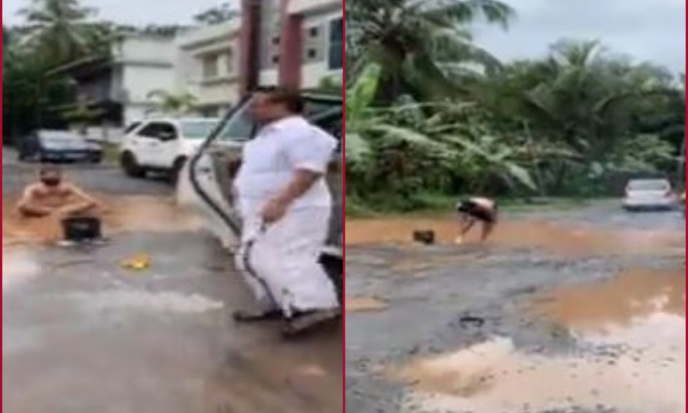 Kerala man bathes, washes cloth on road to protest against potholes (WATCH)