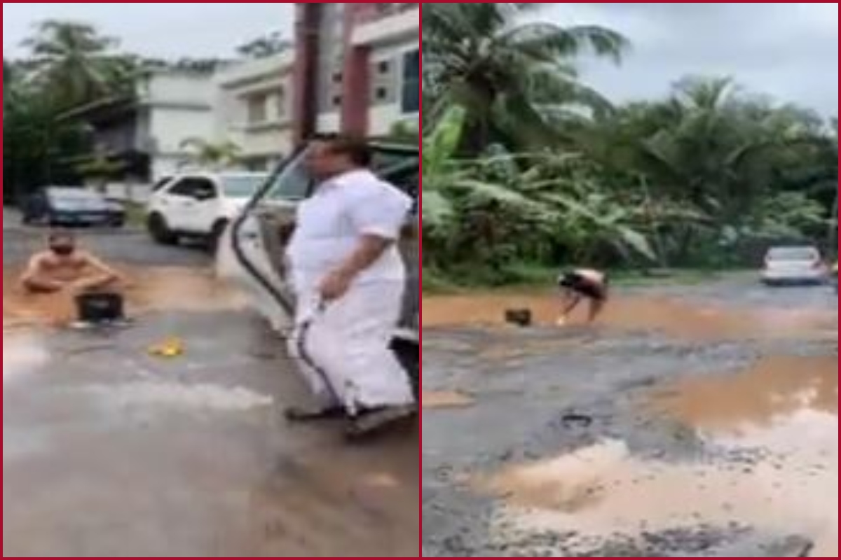 Kerala man bathes, washes cloth on road to protest against potholes (WATCH)