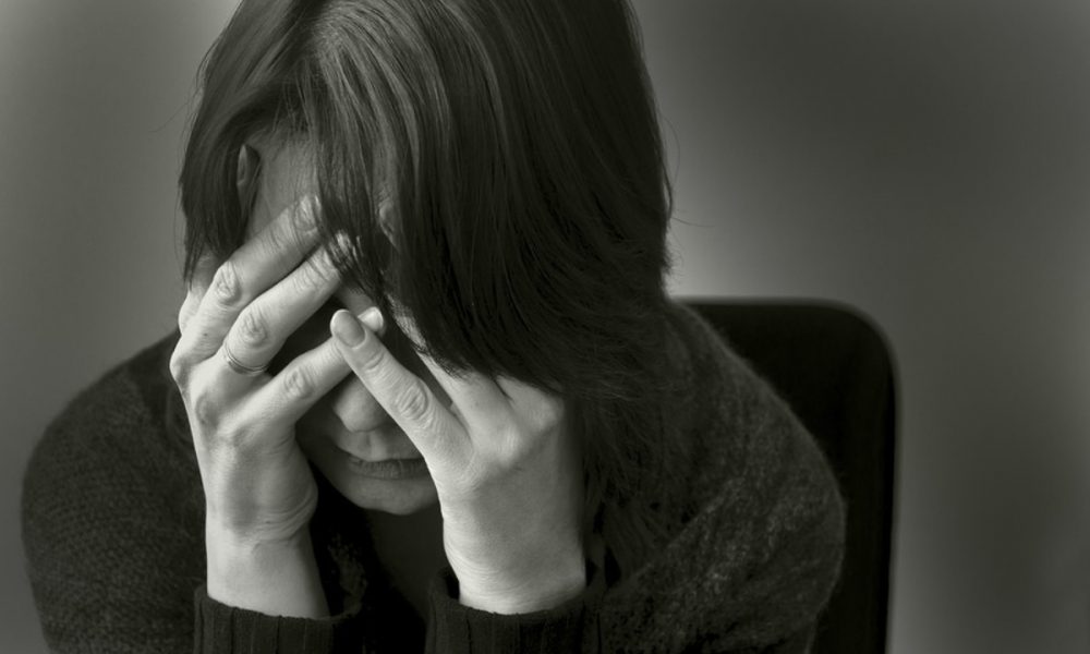 What causes depression, and what are its signs and symptoms?