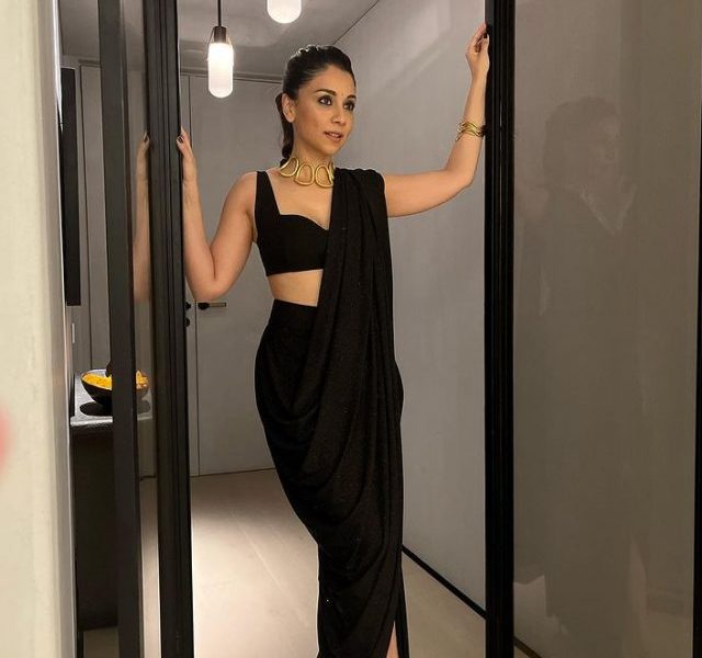 Amrita Puri poses in black saree at RiAli’s wedding function
