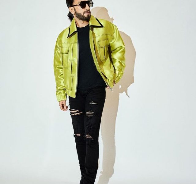 Ranveer Singh poses in green jacket and rugged jeans