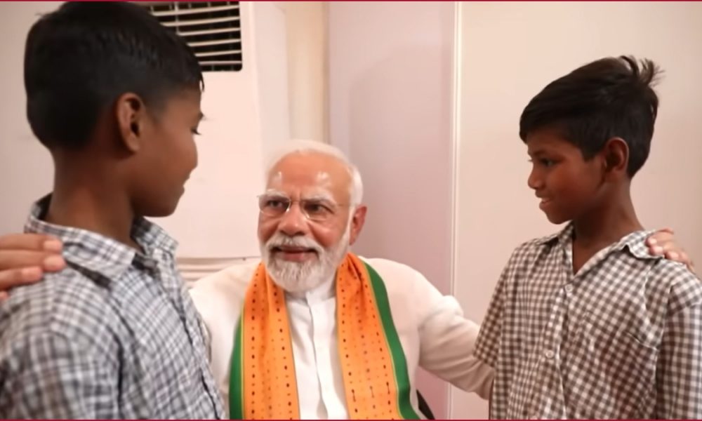 PM Modi meets two tribal orphan boys in Gujarat