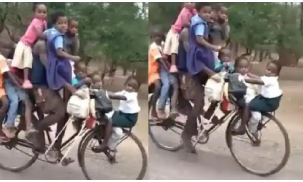 Watch viral video: Man rides bicycle with nine kids from front to end