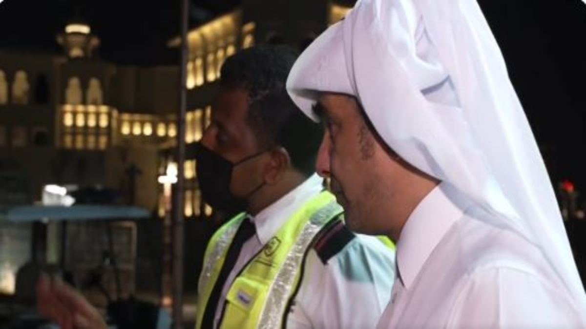 officials stopping reporter in Qatar 1