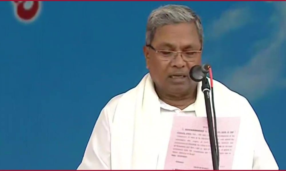A reluctant Siddaramaiah takes oath with DKS as Deputy CM and Eight Ministers