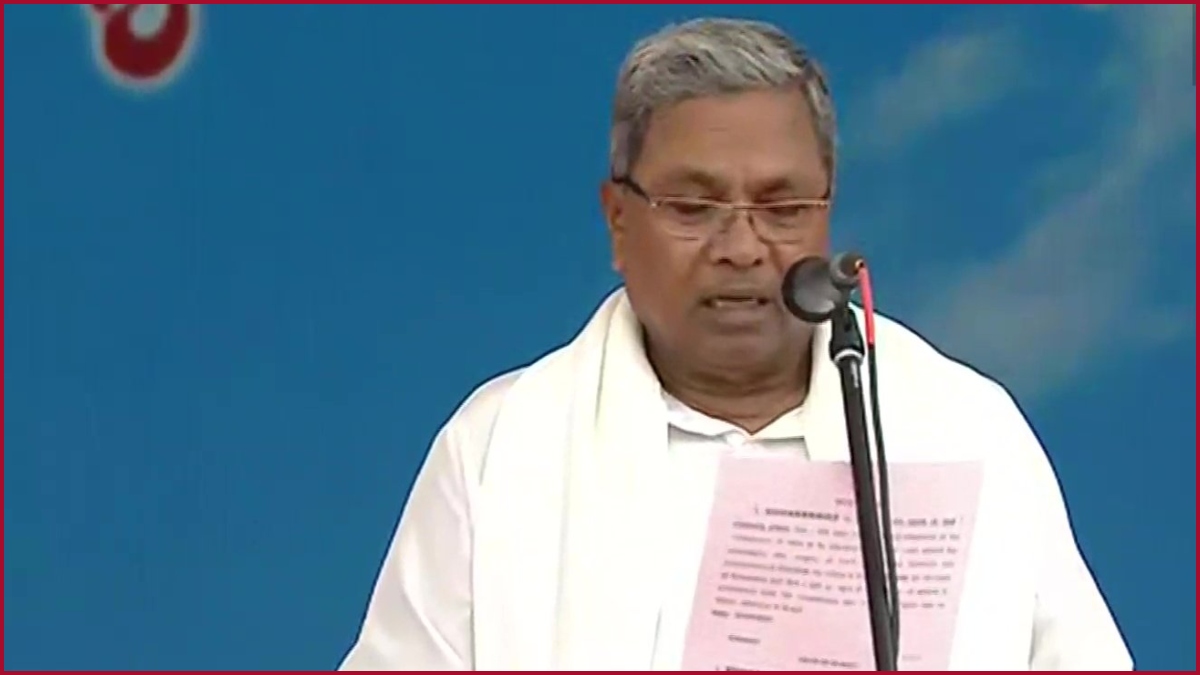 A reluctant Siddaramaiah takes oath with DKS as Deputy CM and Eight Ministers