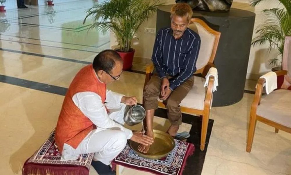 MP CM Shivraj Chouhan washes feet of urination victim, honours him with a shawl