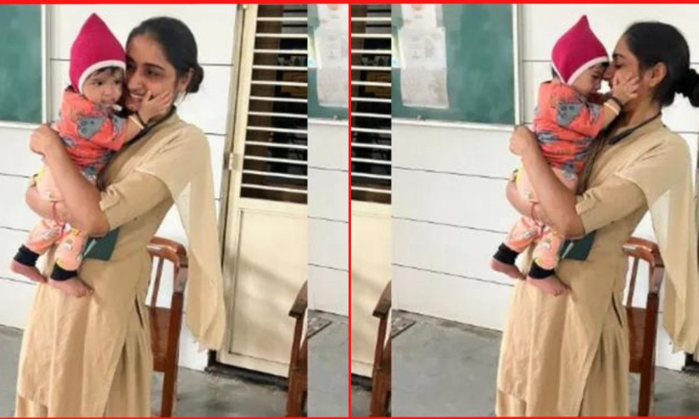 Woman constable from Ahmedabad tends to an infant outside an examination center, Heartwarming act goes viral