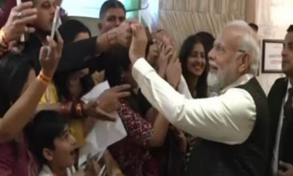 South Africa: PM Modi greets members of Indian diaspora gathered in Johannesburg hotel