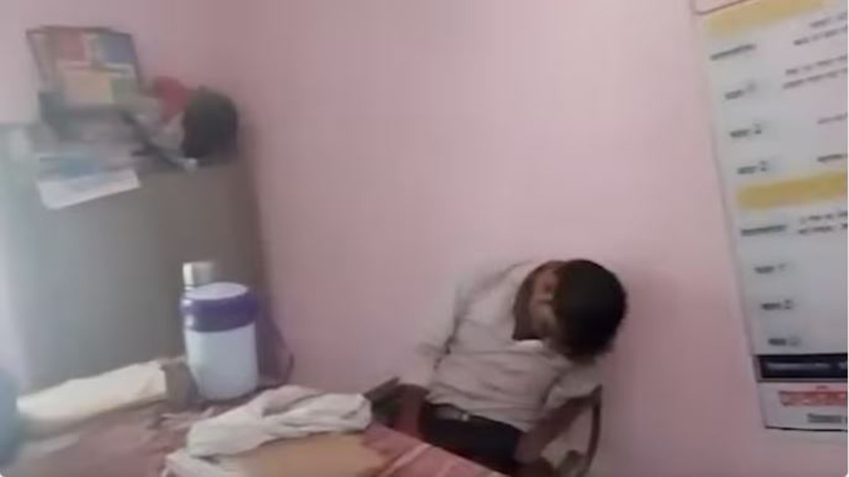 Drunk School Teacher lying on chair inside classroom suspended (Watch Video)
