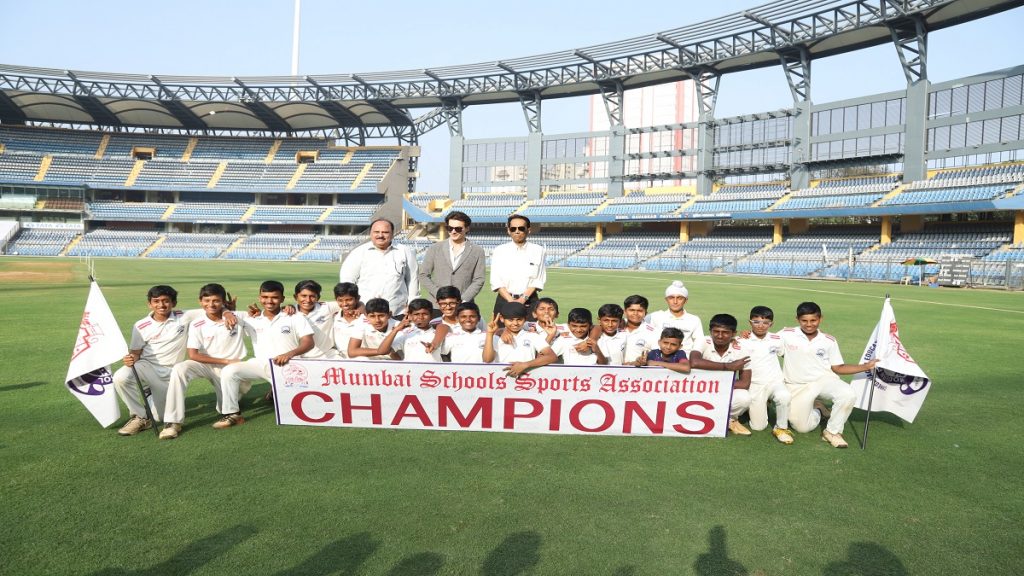Modern English School, Kandivali celebrate their Giles Shield success in the presence of former Mumbai captain Milind Rege (right), actor Mohsin Khan (centre) and MSSA secretary Nadeem Memon at the Wankhede Stadium.