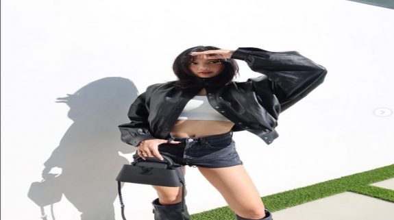 Blackpink’s Lisa slays in black leather jacket and knee-high boots with a Louis Vuitton Bag