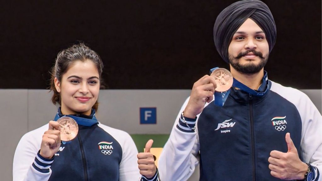 Manu Bhaker and Sarabjot Singh winning bronze in the 25m Mixed Team event at Paris 2024