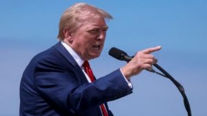 Trump signs order to ban travel to US from 12 nations, partially restricts entry of nationals from 7 nations